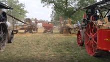 Two steam engines threshing